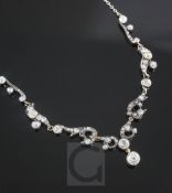 A Victorian gold, silver and old mine cut diamond set platinum chain necklace, of scrolling