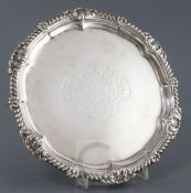 A George III silver circular salver by Paul Storr, with shell and gadrooned border and engraved