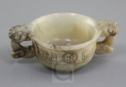 A Chinese white, grey and black veined jade two handled cup, 16th / 17th century, the slightly