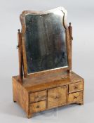 An early 18th century walnut toilet mirror, with five drawer boxed base, W.1ft 5in. H.2ft 2in.