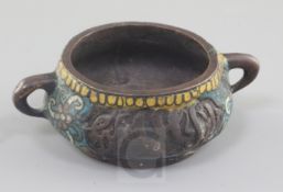 A Chinese bronze and champleve enamel two handled censer, with arabic inscription to each side, seal