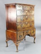 An early 18th century walnut chest on stand, fitted three short over three long and three base