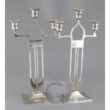 A pair of WMF Secessionist design silvered brass candelabra, height 16.5in.