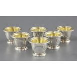 A set of six William IV silver egg cups by Paul Storr, with fluted spiral decoration, engraved crest