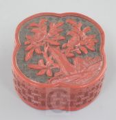 A Chinese two-colour cinnabar lacquer quatrefoil-shaped box, Qianlong period, the cover carved in