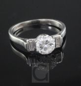 A mid 20th century platinum and single stone diamond ring, with baguette cut diamond set