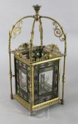 A late Victorian Aesthetic period gilt brass and stained glass hall lantern, the panels engraved