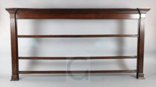A George III oak plate rack, with dentil cornice and three open shelves, W.7ft8in. H.4ft5in.