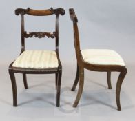 A set of ten William IV brass strung mahogany dining chairs, with foliate scroll carved backs and