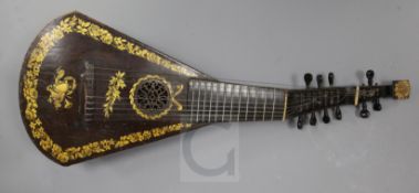 A Regency guitar lute, by Barry, London, c.1820, gilt decorated on the black japanned table, ten