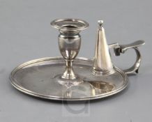 A George III silver reeded circular chamberstick and matching extinguisher by John Edwards,