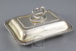 A George V silver entree dish and cover with handle by Mappin & Webb, with gadrooned borders,