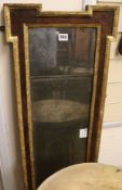 An early 18th century parcel gilt walnut overmantel, with original glass plate W.130cm