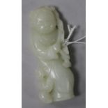 A white jade carving of a female with boy