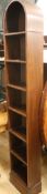 A tall narrow bookcase with arched top W.31cm