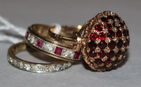 Two gold and gem set eternity rings, on stamped 9ct and one other 9ct gold gem set ring.