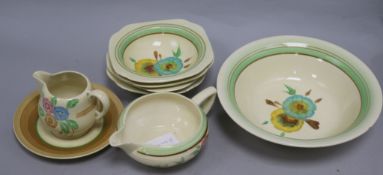 A Clarice Cliff fruit set, a cream jug and a gravy pot