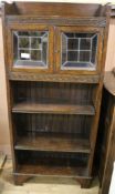 An oak open bookcase with glazed top W.61cm