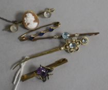 A 14ct gold and gem set bar brooch, a 9ct gold bar brooch and three other bar brooches.