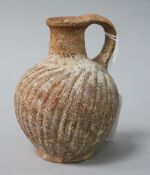 A Roman wrythen fluted terracotta jug