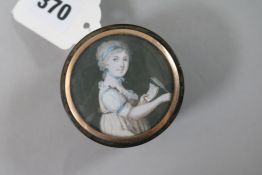 A Regency tortoiseshell circular snuff box, the lid inset with a miniature of a girl