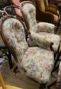 A Victorian walnut armchair and a similar nursing chair with carved cresting (a.f.)
