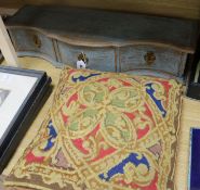 A three drawer serpentine table top cabinet and a woolwork cushion