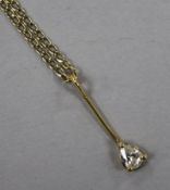 A yellow metal and pear shaped diamond set pendant, on a 9ct gold fine link chain, pendant 21mm.