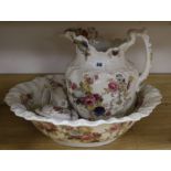 A Victorian four piece floral printed toilet set