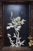 A Japanese Meiji period bone and lacquer plaque