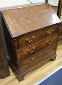 A George III oak bureau W.76cm