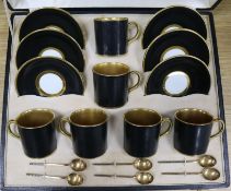 An Allertons coffee can set, silver gilt spoons, cased
