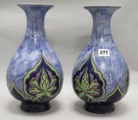 Eliza Simmance for Royal Doulton, a pair of blue ground vases