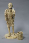 A Japanese sectional ivory figure of a farmer