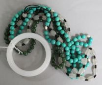 Three hardstone bead necklaces and a bangle.