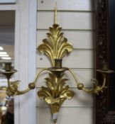 A pair of gilt metal three light wall sconces