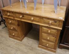 A pine pedestal desk W.121cm