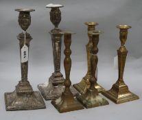A pair of Sheffield plated candlesticks and two pairs of brass candlesticks (6)