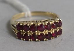 A 14ct gold and ruby double-row ring, size P.