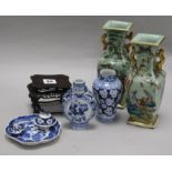 Two famille verte vases, two blue and white Chinese vases, a dish and a carved stand