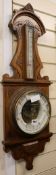 A carved oak barometer, W.28cm