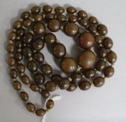 A single strand olive coloured bead necklace, gross 50 grams, 80cm.