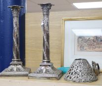 A pair of plated column candlesticks