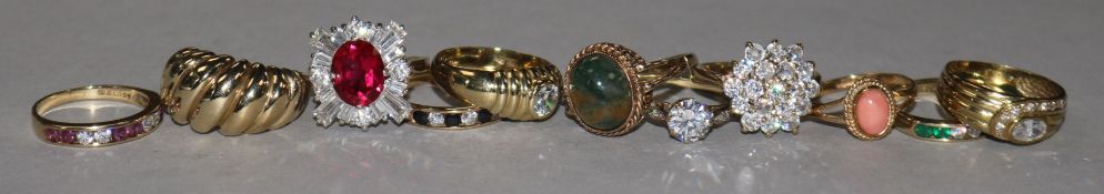 Eleven assorted 9ct gold and gem set dress rings.