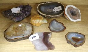 A collection of Brazilian mineral specimens, including amethyst, a split quartz geode, agate