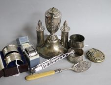 A pair of silver napkin rings, cased, sundry other silver napkin rings, plated items, including a