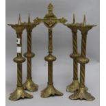 A set of four French candlesticks and crucifix