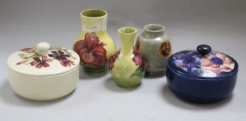 Moorcroft: a yellow ground vase, two bowls and covers, a grey ground vase and a yellow ground vase