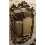 A cartouche shaped gilt framed mirror and another smaller W. 92cm, W.45cm