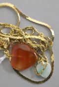 A heart-shaped hardstone pendant, a similar jade pendant, a similar 18ct gold pendant and a 14ct